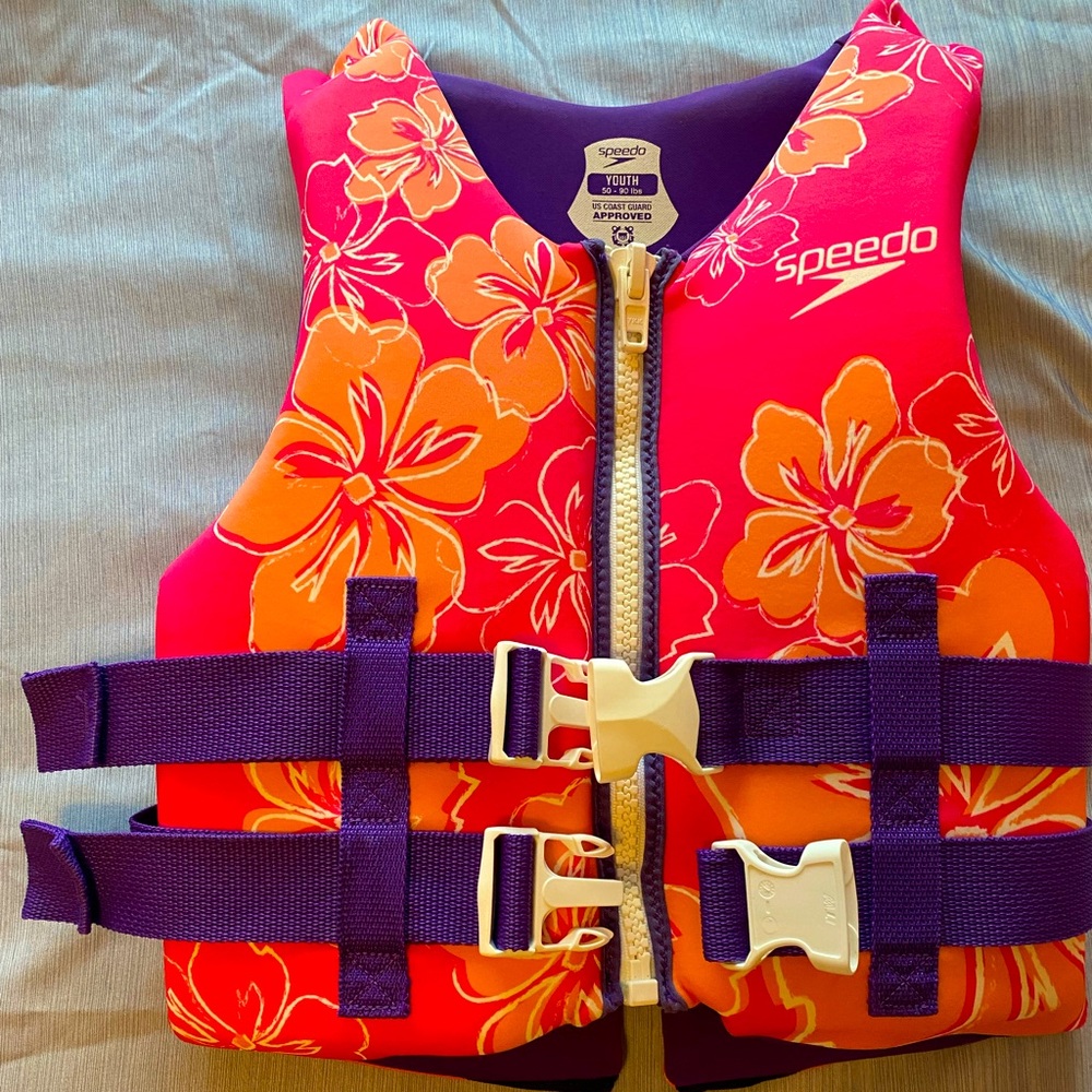 Speedo Zip-up Vest Flotation Aid Youth 50-90lbs. Pink exterior, purple interior